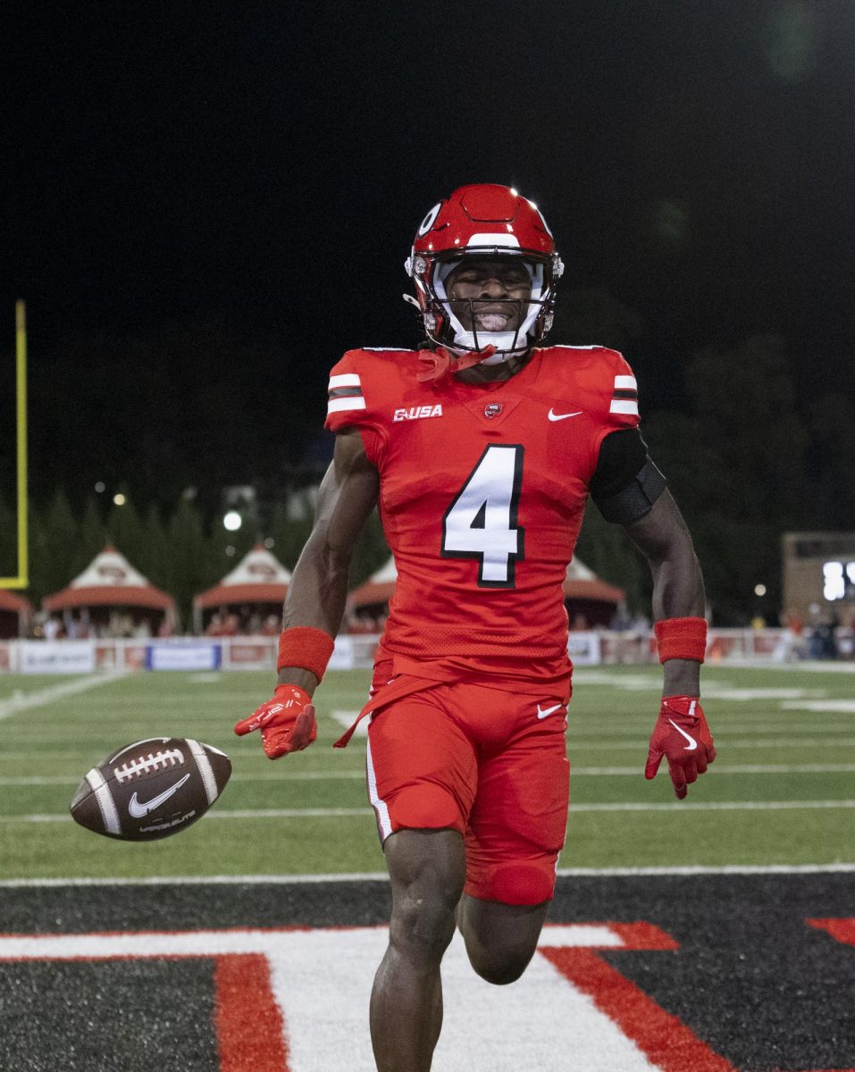 Western Kentucky Hilltoppers wide receiver Michael Mathison (4) flips the ball after a touchdown during the matchup against the University of Texas at El Paso at Houchens Industries L. T. Smith Stadium in Bowling Green on Thursday, October 10, 2024. Mathison recorded two receiving touchdowns. WKU won 44-17.