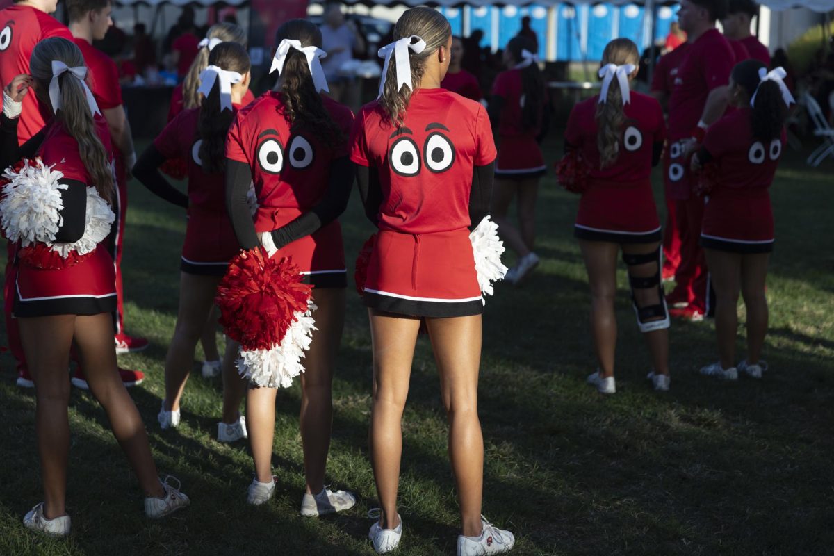 Members of the cheer team rehearse stunts at the tailgate before WKU’s football game against UTEP at Houchens Industries L. T. Smith Stadium on Thursday October 10, 2024. 