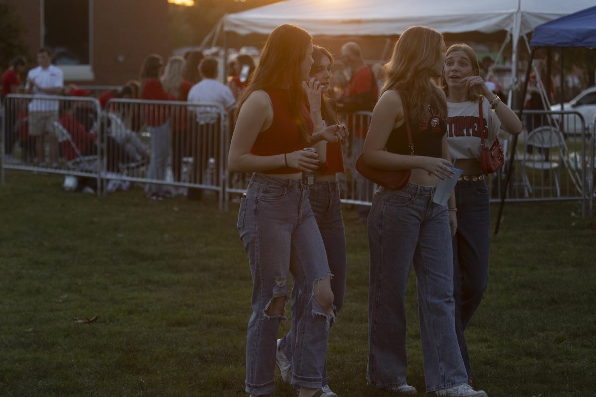 A group of girls hang out at the tailgate before WKU’s football game against UTEP at Houchens Industries L. T. Smith Stadium on Thursday October 10, 2024. 