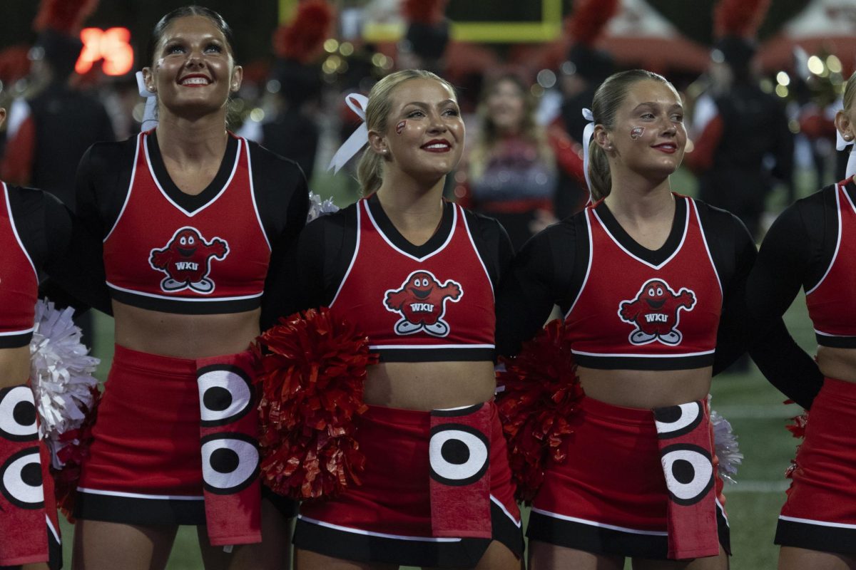 Cheerleaders come together to sway to music before WKU’s football game against UTEP at Houchens Industries L. T. Smith Stadium on Thursday October 10, 2024. 