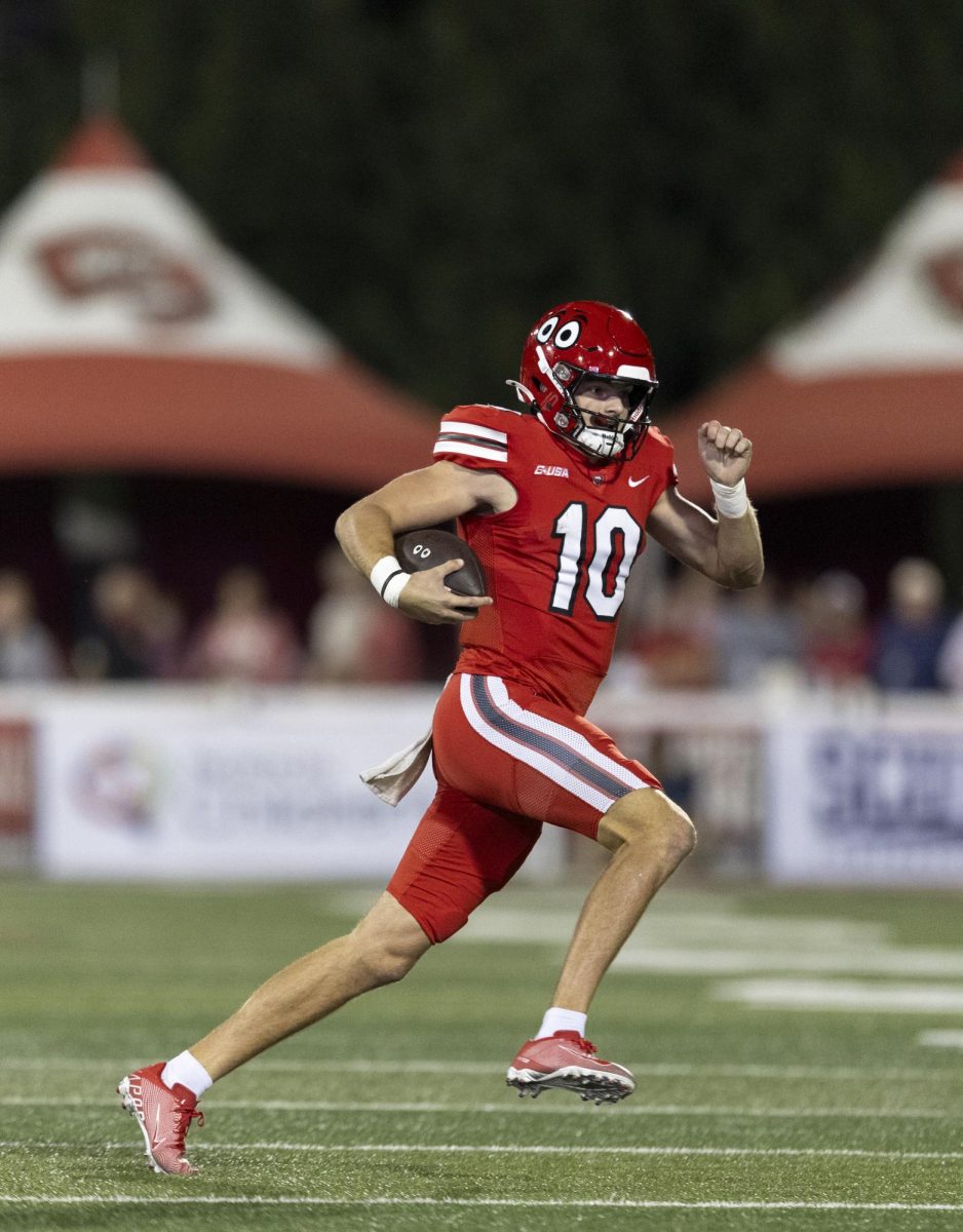 Western Kentucky Hilltoppers quarterback Caden Veltkamp (10) makes an attempt to gain yards during the matchup against the University of Texas at El Paso at Houchens Industries L. T. Smith Stadium in Bowling Green on Thursday, October 10, 2024. Veltkamp recorded three touchdowns and threw for 264 yards. 