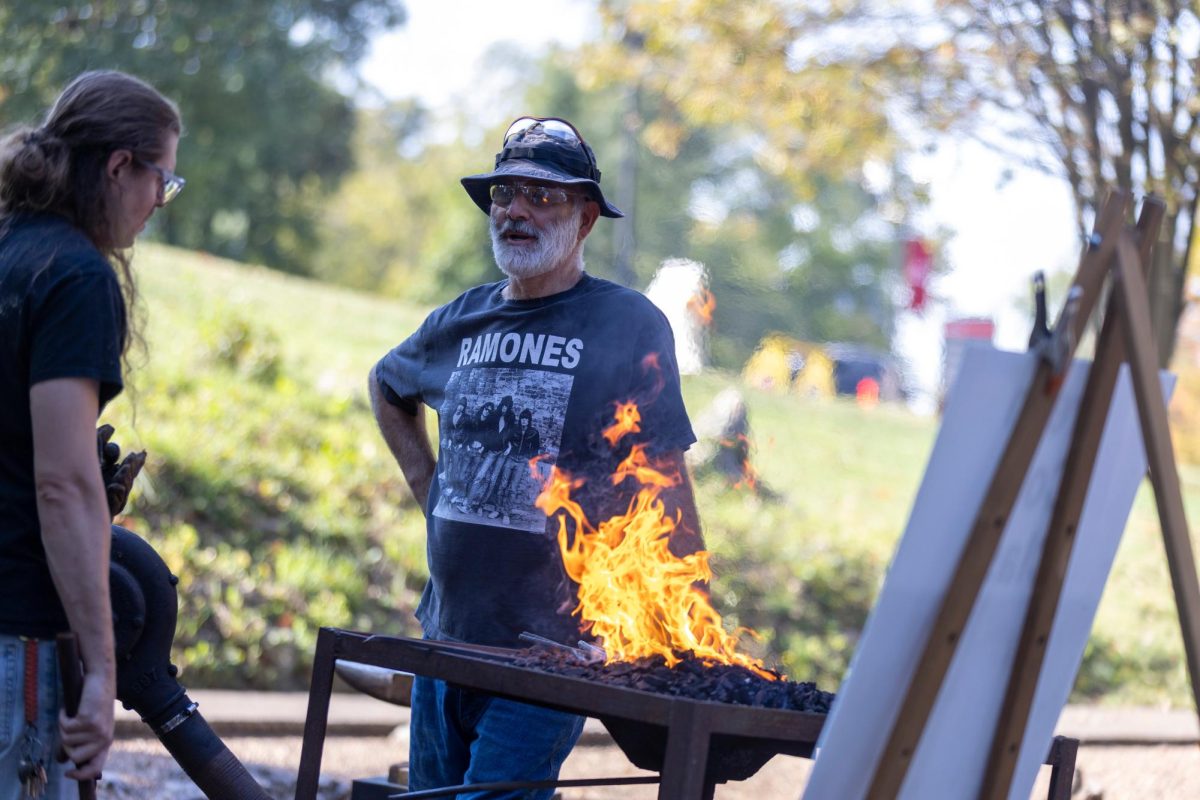 Chris Radus is a demonstrator at hammer in this year to demonstrate Green Coal Class at WKU’s “Hammer-in” 2024 at the Kentucky Museum on October 12 2024. He forges art through recycled metal and wood, his metal working roots go back to his grandfather who was a professional blacksmith in the old country Hungary. 