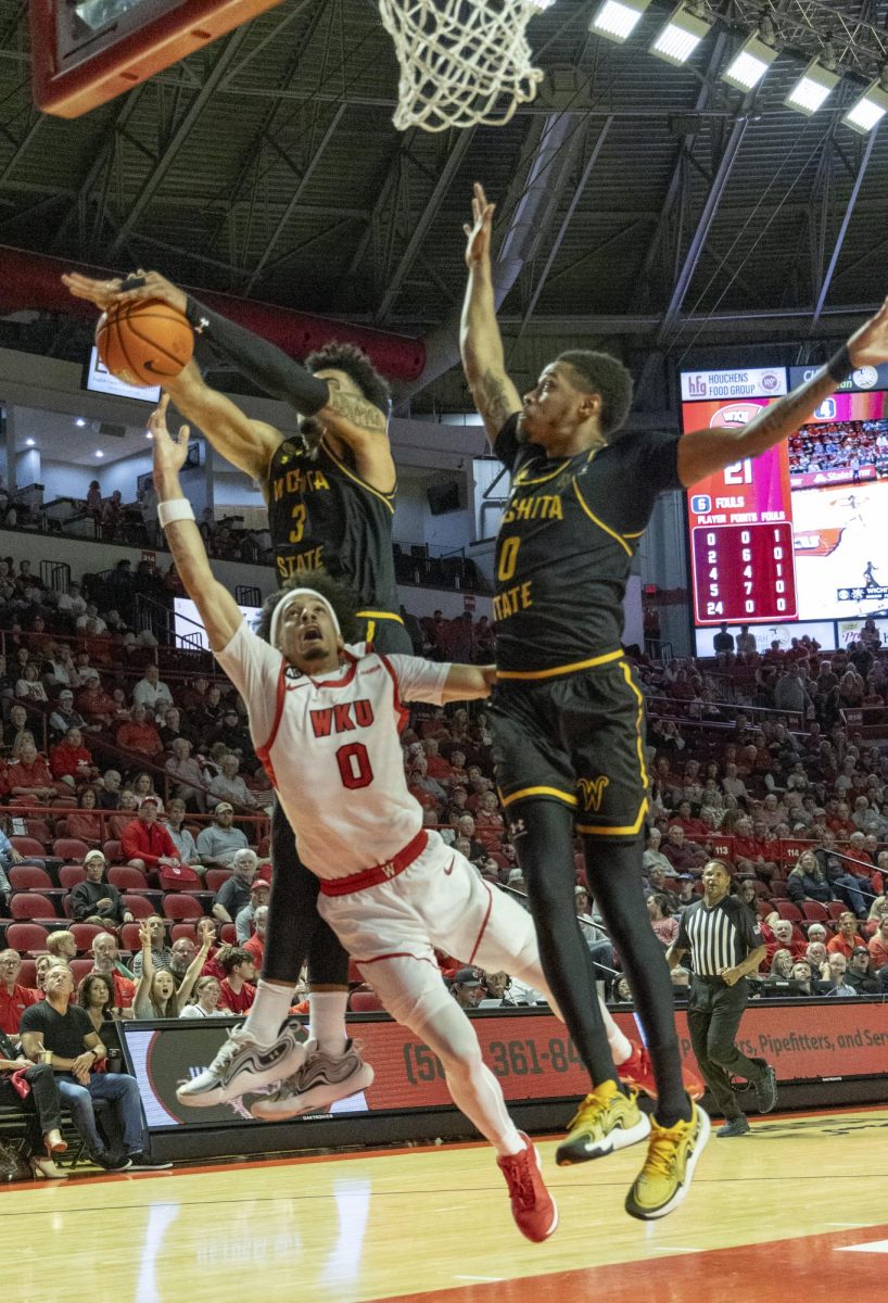 Western Kentucky University guard Braxton Bayless (0) attempts to shoot a layup during a game against Wichita State University at Diddle Arena on Monday, Nov. 4, 2024.