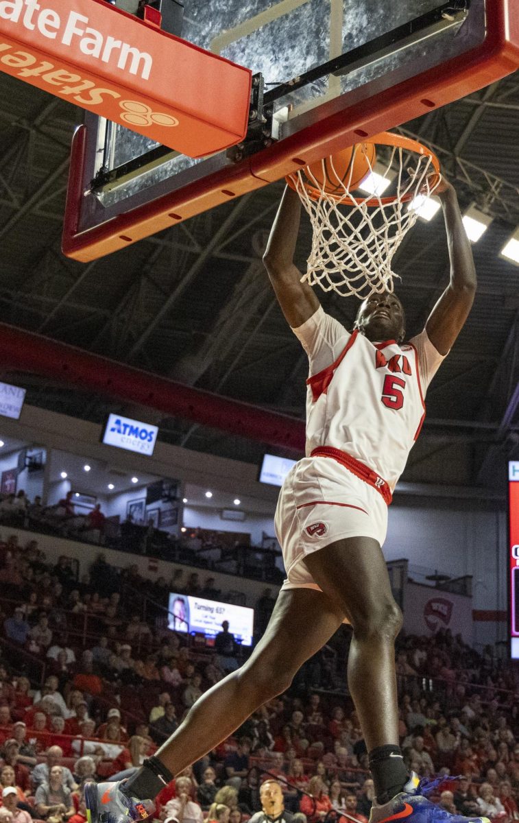 Western Kentucky University forward Babacar Faye (5) dunks the ball during a game against Wichita State University at Diddle Arena on Monday, Nov. 4, 2024.