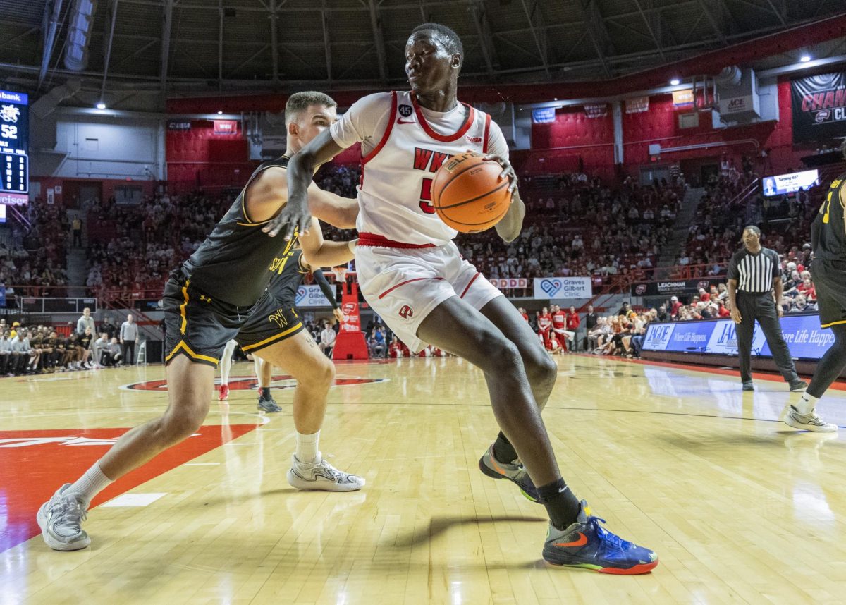 Western Kentucky University forward Babacar Faye (5) pivots past his opponent during a game against Wichita State University at Diddle Arena on Monday, Nov. 4, 2024.