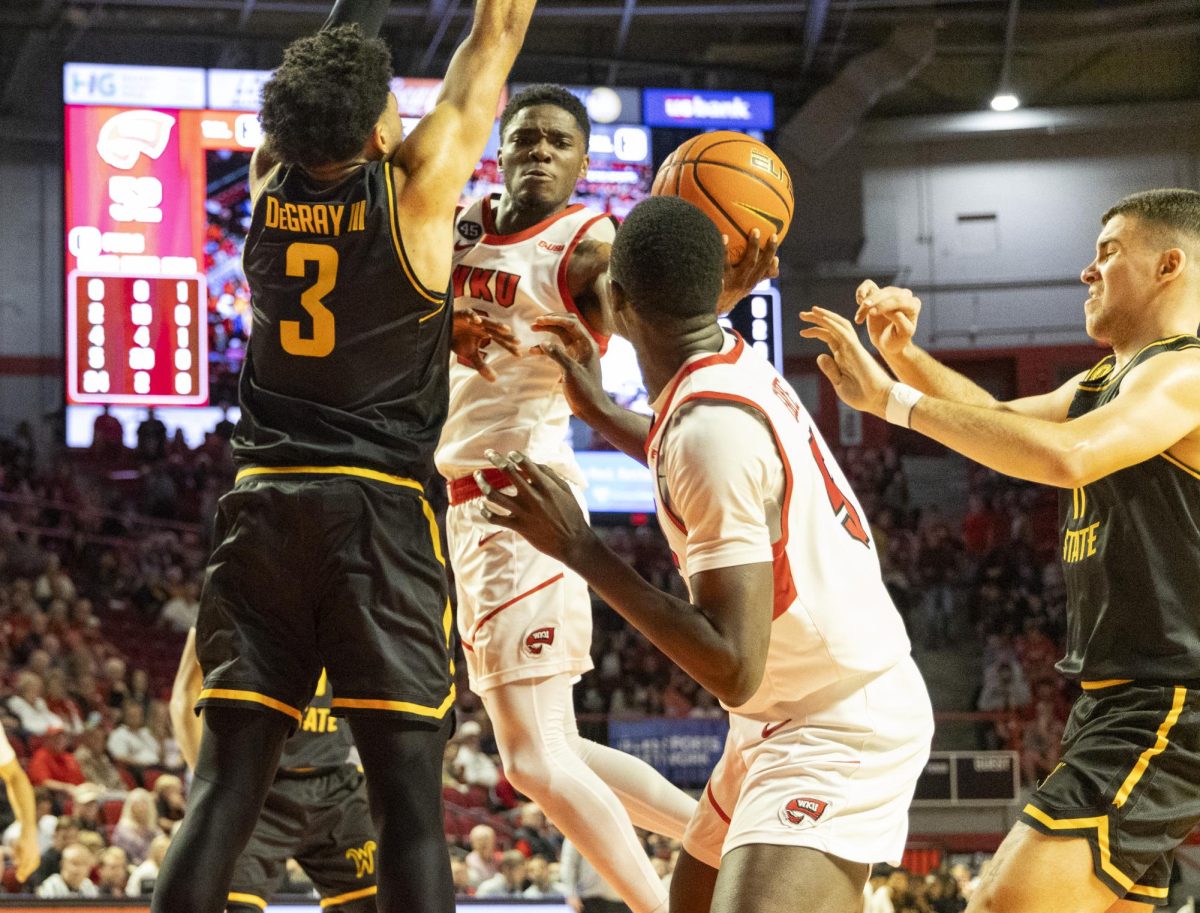 Western Kentucky University guard Don McHenry (2) passes the ball to forward Babacar Faye (5) during a game against Wichita State University at Diddle Arena on Monday, Nov. 4, 2024.