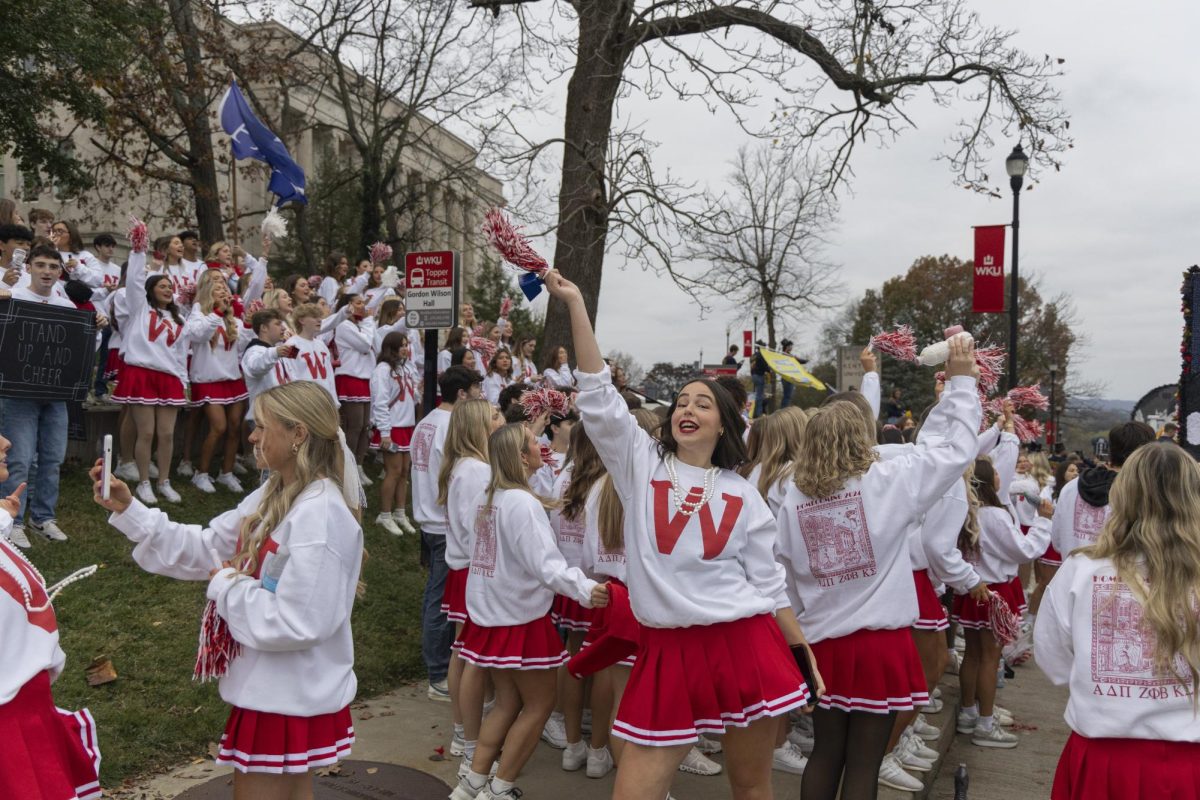 Karlee Powell, chapter president of Alpha Delta Pi, dances before the WKU Homecoming Parade Friday, Nov. 15, 2024.