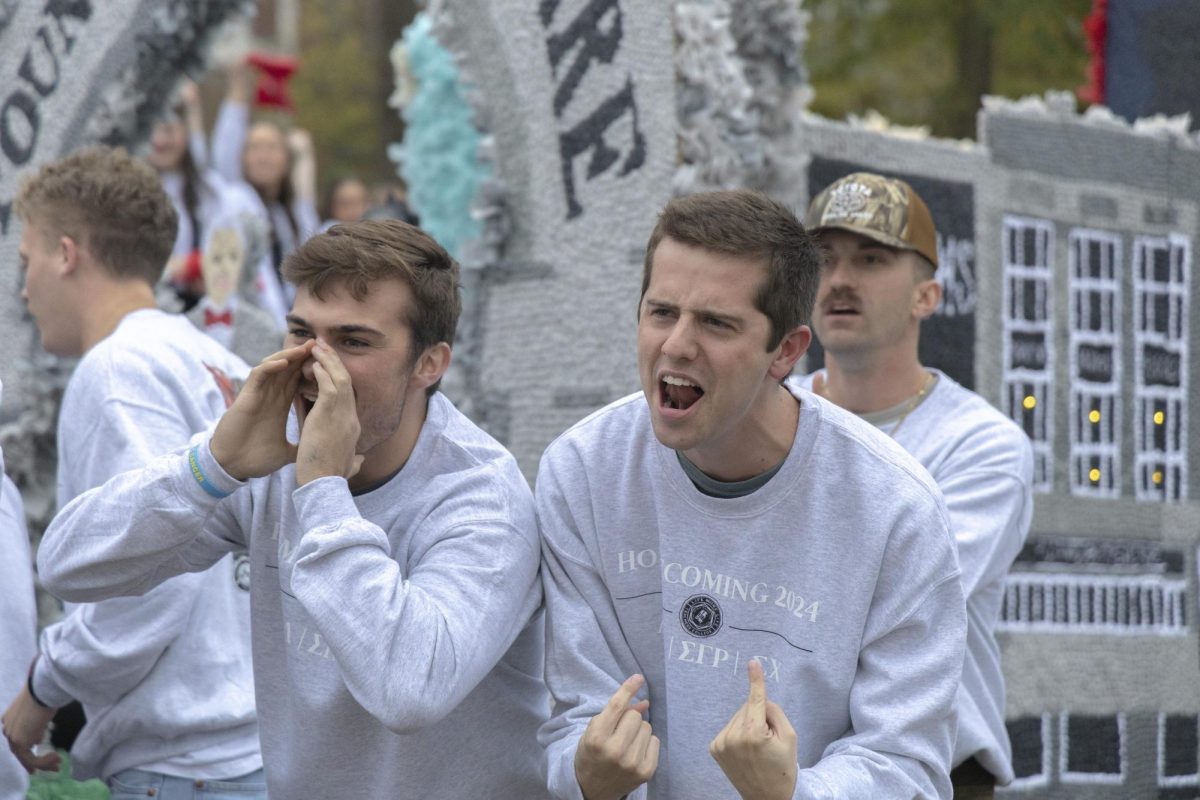 Luke Rabe (left) and Jack Charcoal, members of Sigma Chi, scream before WKU’s Homecoming Parade Friday, Nov. 15, 2024.