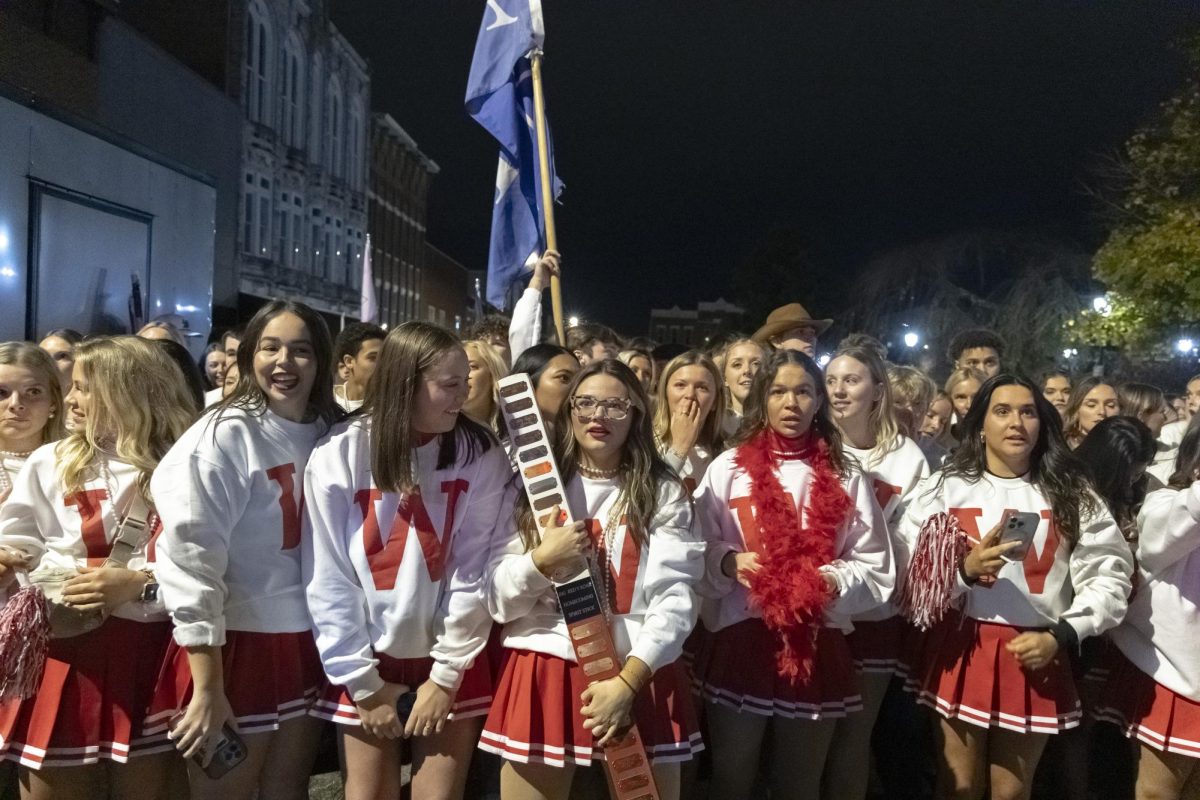 Riley Jaggers, member and homecoming chair of Alpha Delta Pi, waits in anticipation before winning an award at the Big Red Roar event after WKU’s Homecoming Parade Friday, Nov. 15, 2024.