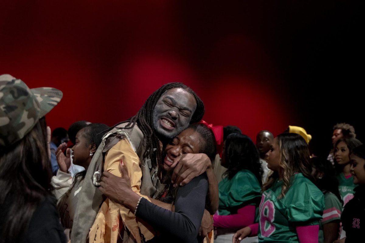 Avery Wells (right) and Hannah Turner, Phi Beta Sigma and Delta Sigma Theta embrace after their fraternity and sorority wins The best Step Show Award at WKU’s annual Homecoming Step Show at the Capitol Theater on Saturday, Nov. 16, 2024.