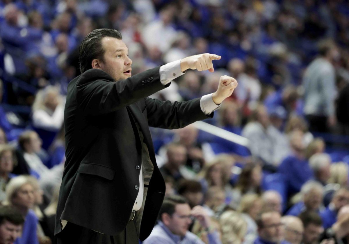 WKU head coach Hank Plona points to his defense as they defend against University of Kentucky in Rupp Arena in Lexington, Ky., on Tuesday, Nov. 26, 2024. 