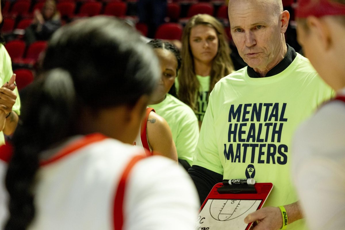 WKU Head coach Greg Collins speaks with his team before the Lady Toppers game against Tennessee State University in Bowing Green, Ky. on Wednesday, Nov. 27, 2024.