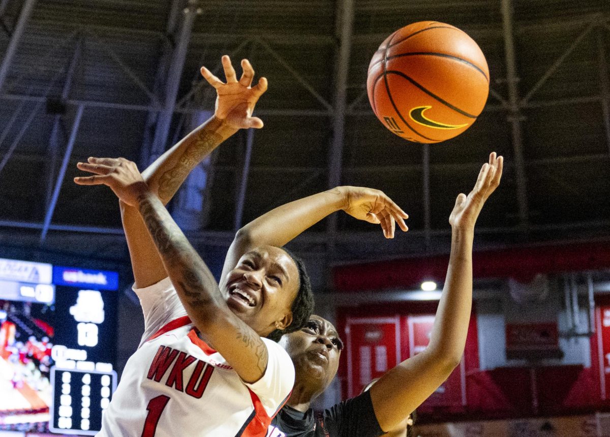 WKU guard Destiny Salary (1) fights for the ball during the Lady Toppers game against Tennessee State University in Bowing Green, Ky. on Wednesday, Nov. 27, 2024.