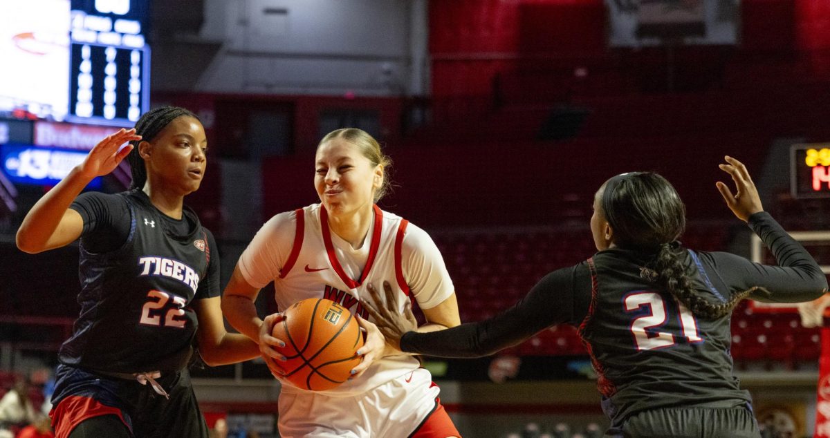 WKU forward Zsofia Telegdy (23) fights through defenders during the Lady Toppers game against Tennessee State University in Bowing Green, Ky. on Wednesday, Nov. 27, 2024.