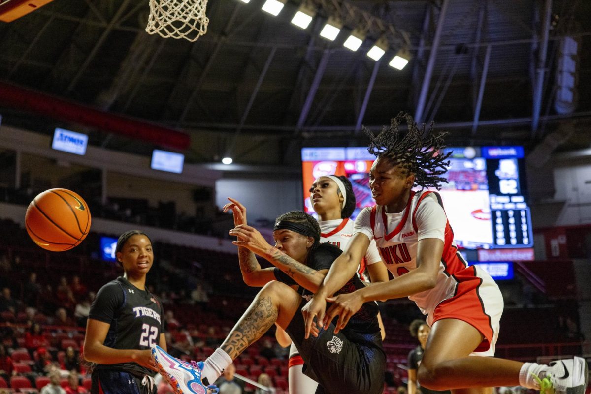 Multiple players fight for a loose during the Lady Toppers game against Tennessee State University in Bowing Green, Ky. on Wednesday, Nov. 27, 2024.