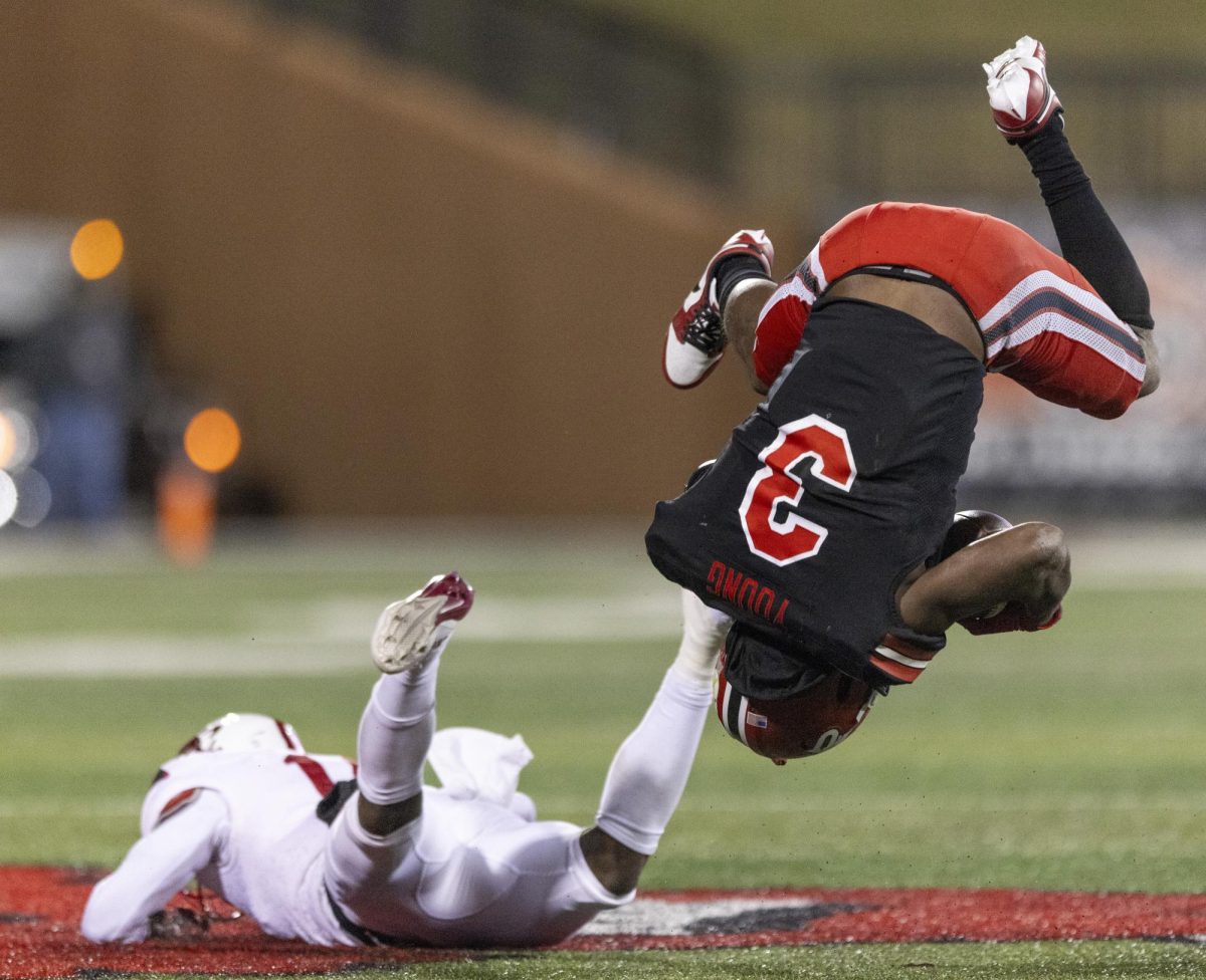 Western Kentucky Hilltoppers running back Elijah Young (3)flips over a defender during WKU's game against Jacksonville State University in Bowing Green, Ky. on Saturday, Nov. 30, 2024.