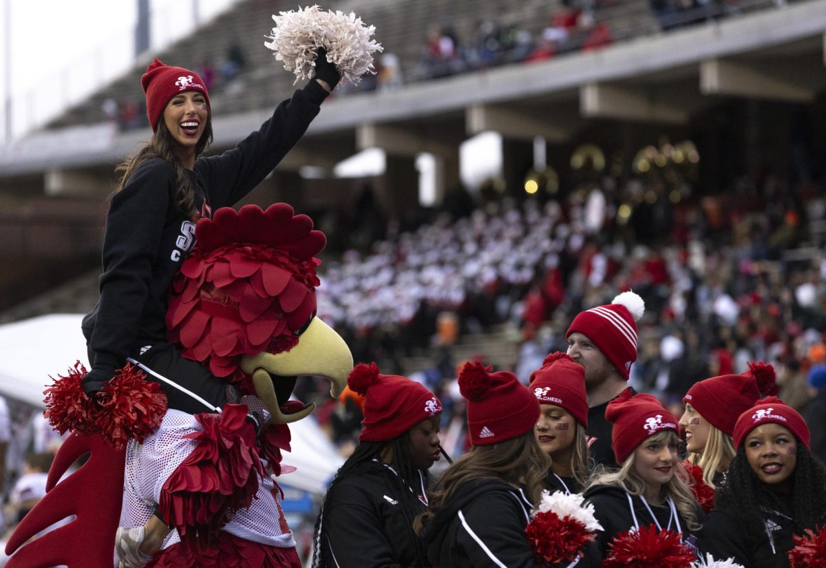 Jacksonville State University cheerleader Kaitlyn Willis cheers her team on whilst sitting atop JSU’s mascot “Clucky” during WKU’s game against Jacksonville State University in Bowing Green, Ky. on Saturday, Nov. 30, 2024. 