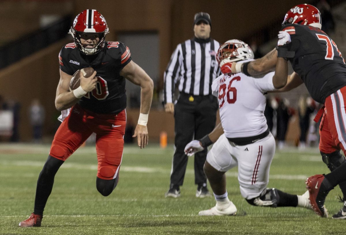 Western Kentucky Hilltoppers quarterback Caden Veltkamp (10) rushes the ball through an opening during WKU’s game against Jacksonville State University in Bowing Green, Ky. on Saturday, Nov. 30, 2024. 