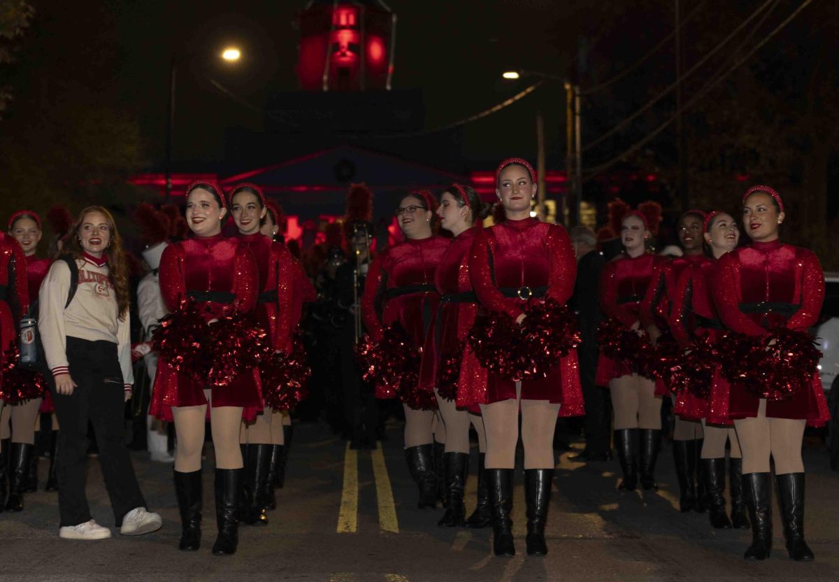 WKU cheerleaders line up as they wait for the parade to start on College St. before the homecoming parade on Friday, Nov. 15, 2024.