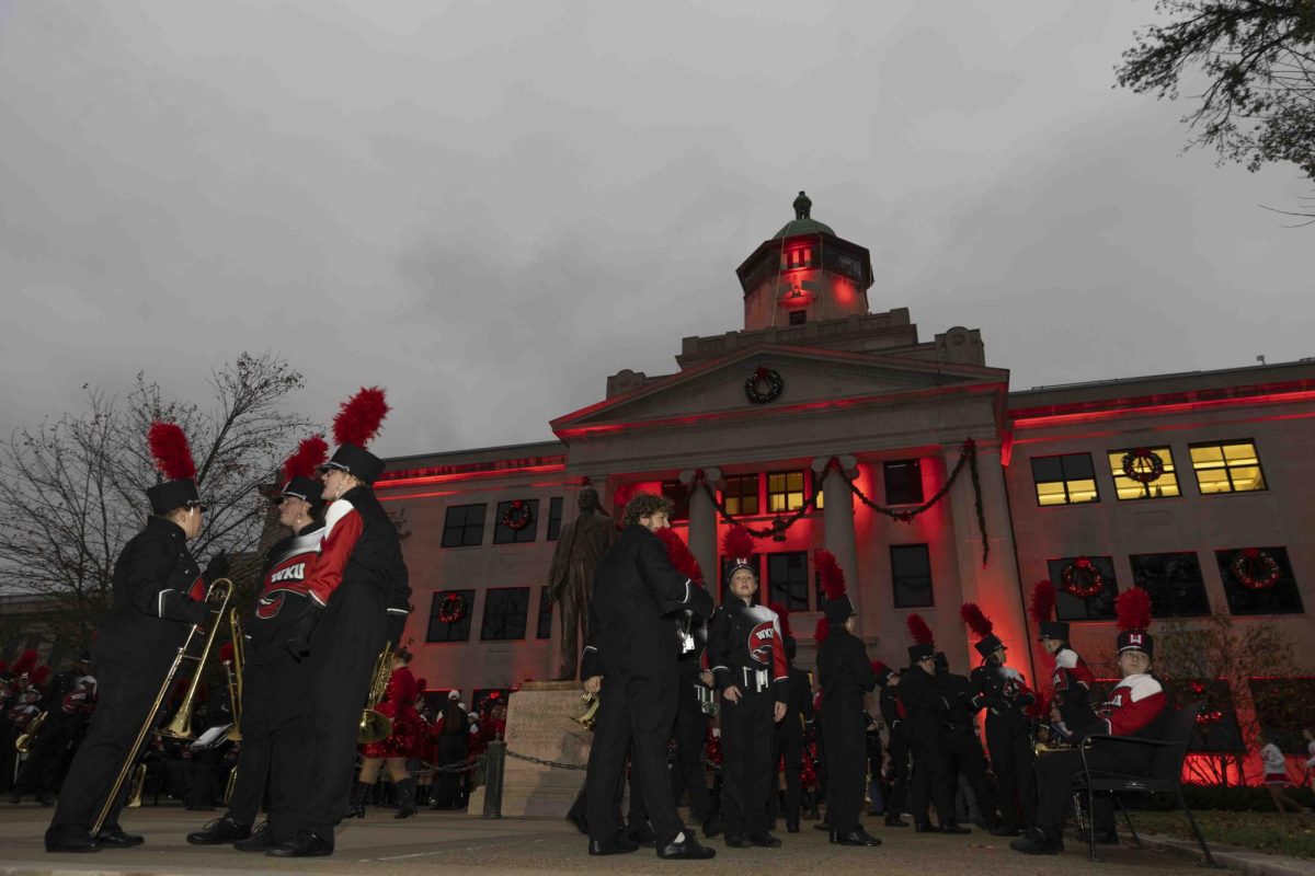 The Big Red Marching Band waits for the start of the parade in front of Cherry Hall before the homecoming parade on Friday, Nov. 15, 2024. 