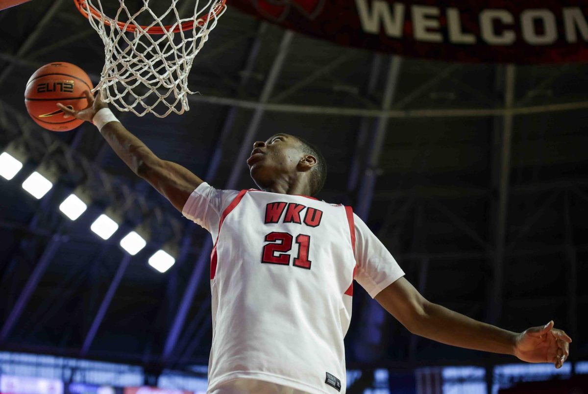 WKU forward Leeroy Odiahi (21) reaches for a rebound during the game in Diddle Arena on Sunday, Nov. 17, 2024. 