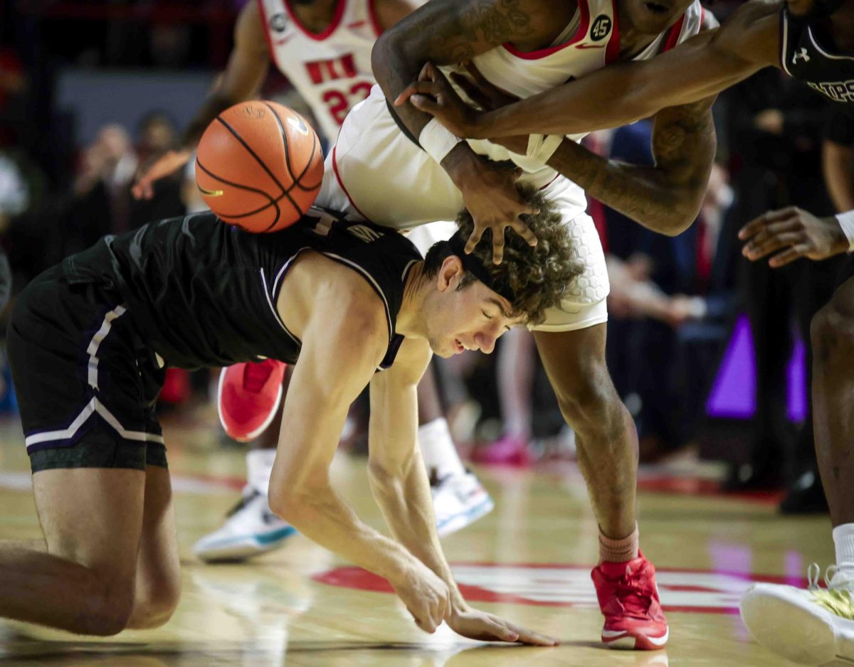 Lipscomb forward Grant Asman (35) fouls WKU guard Julius Thedford (13) during the game in Diddle Arena on Sunday, Nov. 17, 2024. 