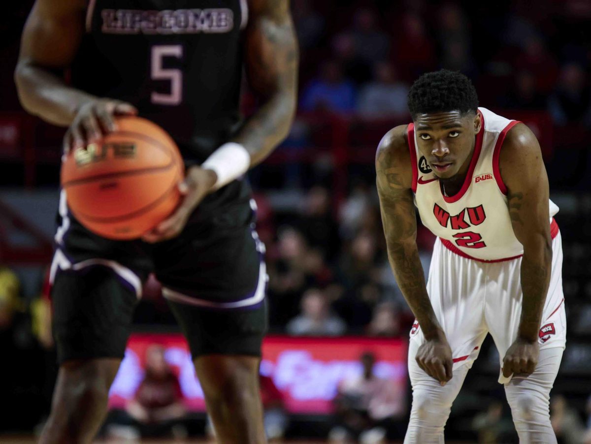 WKU guard Don McHenry (2) looks at Lipscomb guard Miles White (5) as White prepares to shoot a free throw during the game in Diddle Arena on Sunday, Nov. 17, 2024. 