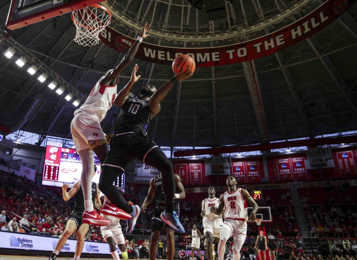 Lipscomb guard Gyasi Powell (10) attempts a layup against the WKU defense on a fast break during the game in Diddle Arena on Sunday, Nov. 17, 2024. 