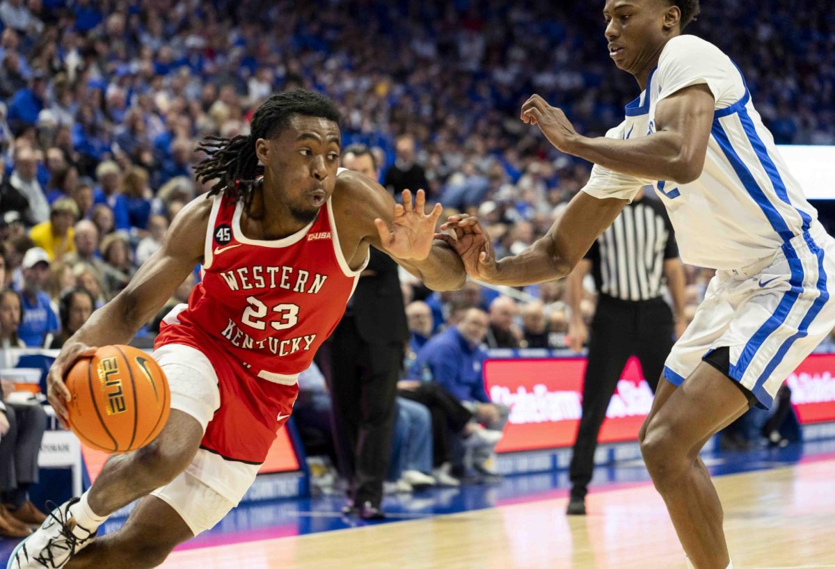 WKU guard Enoch Kalambay (23) drives the baseline during the basketball game against University of Kentucky in Rupp Arena in Lexington, Ky., on Tuesday, Nov. 26, 2024. 