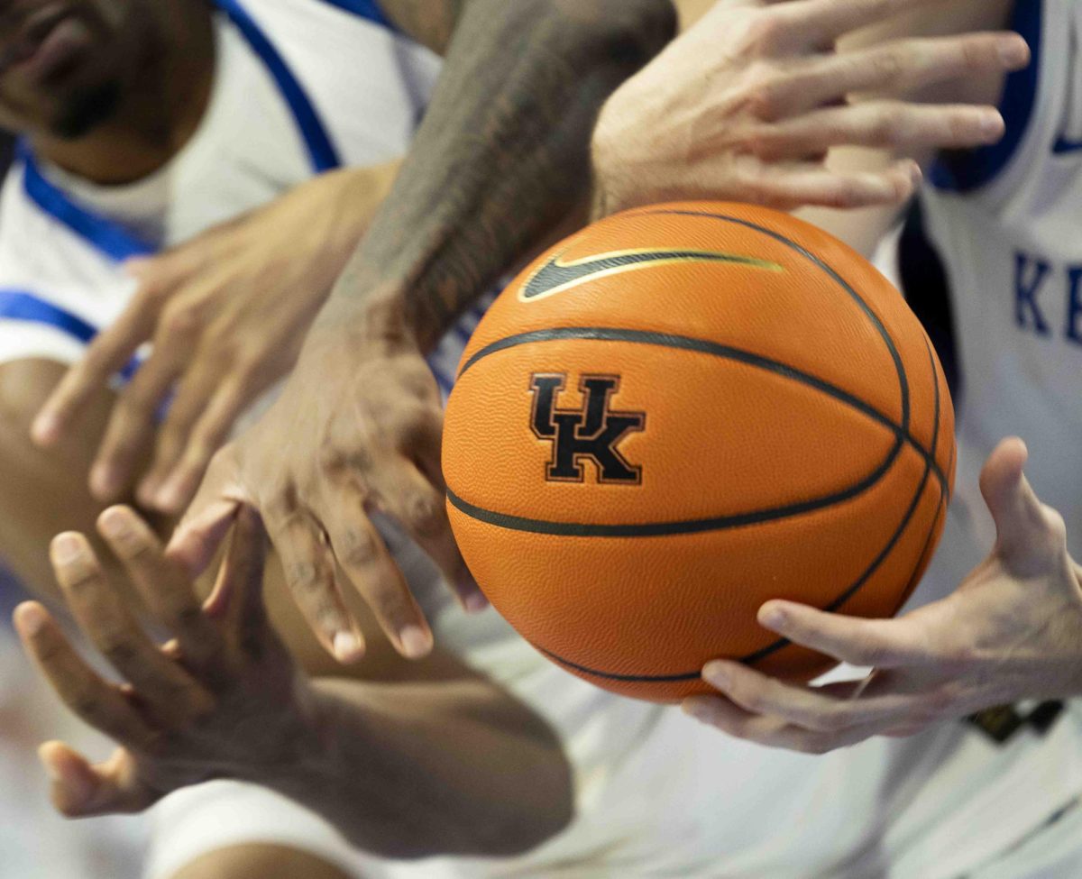 Hands from both University of Kentucky and Western Kentucky University reach for a rebound during the basketball game against in Rupp Arena in Lexington, Ky., on Tuesday, Nov. 26, 2024. 