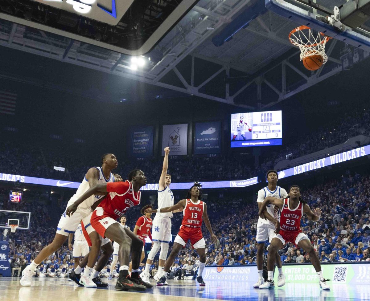 Both WKU and UK react to UK forward Andrew Carr’s made free throw during the basketball in Rupp Arena in Lexington, Ky., on Tuesday, Nov. 26, 2024. 