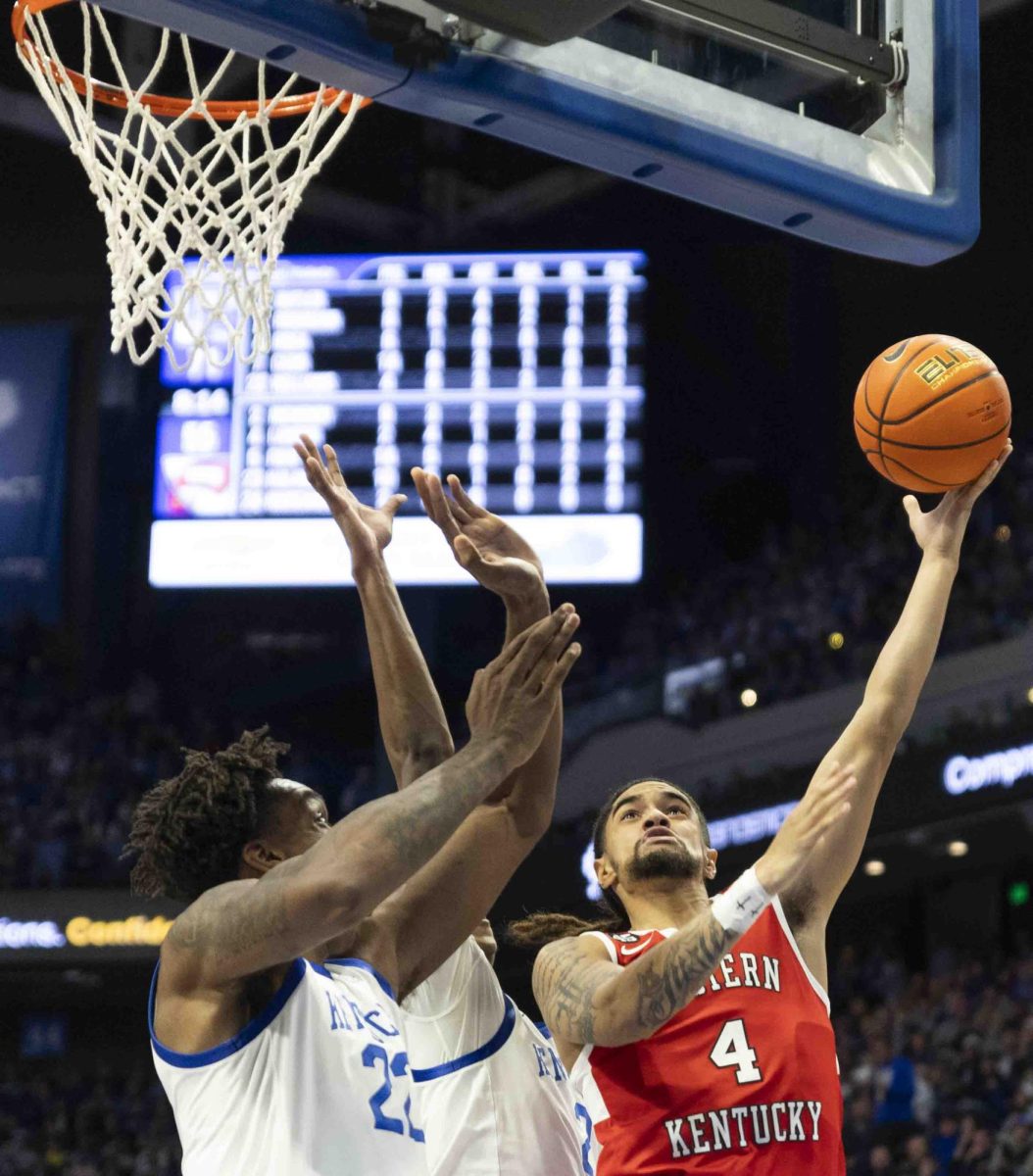 WKU guard Khristian Lander (4) attempts a layup during the basketball game against University of Kentucky in Rupp Arena in Lexington, Ky., on Tuesday, Nov. 26, 2024. 