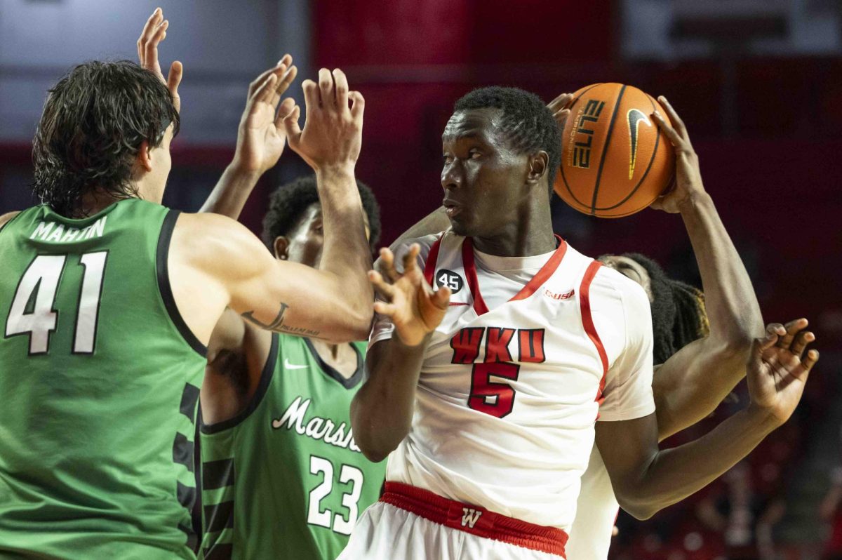 WKU forward Babacar Faye (5) avoids his teammate, Julius Thedford, after a collision during the basketball game against Marshall in E.A. Diddle Arena on Saturday, Nov. 30, 2024. 