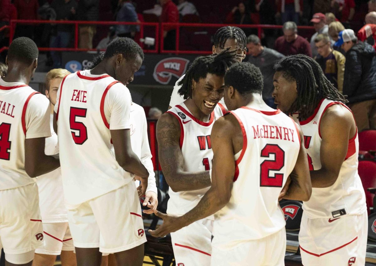 WKU guard Julius Thedford (13) laughs with his teammates after their win against Marshall in E.A. Diddle Arena on Saturday, Nov. 30, 2024. 