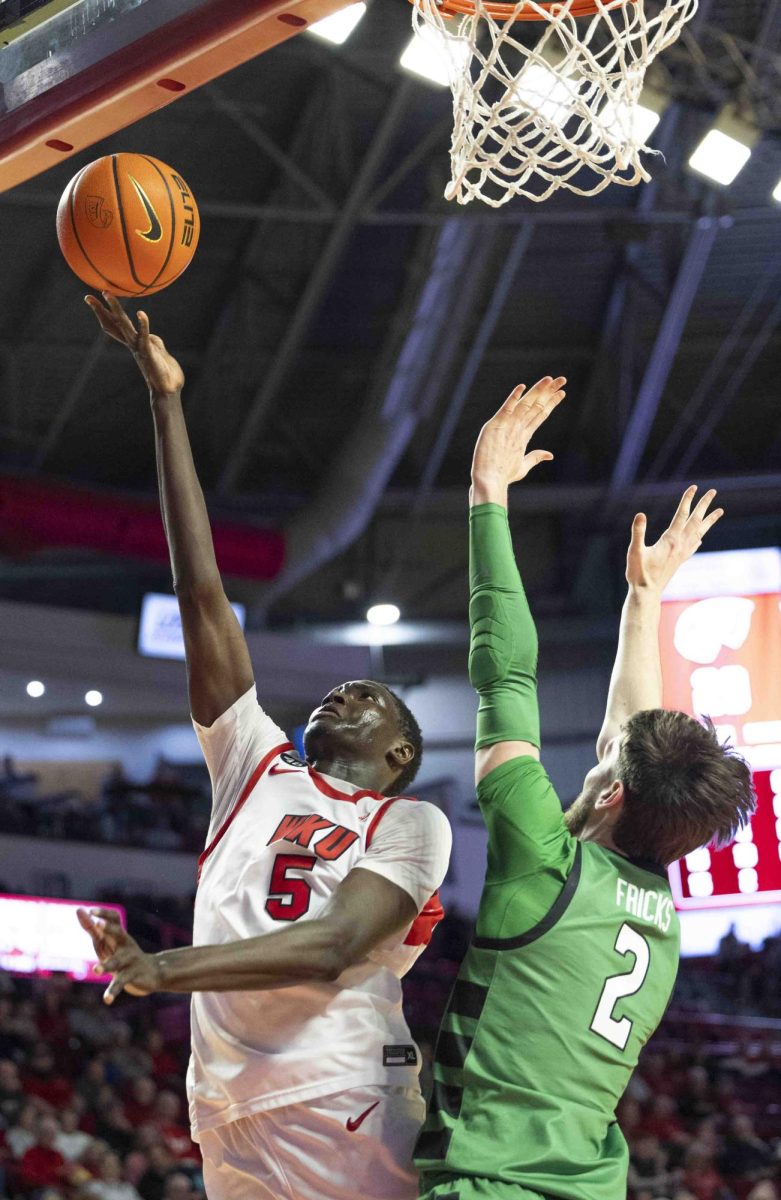 WKU forward Babacar Faye (5) scores on a layup during the second half of the basketball game against Marshall in E.A. Diddle Arena on Saturday, Nov. 30, 2024. 