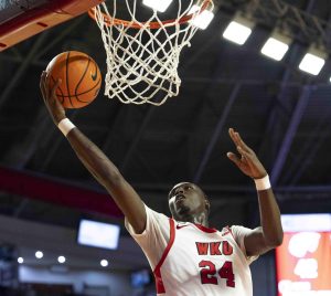 WKU forward Tyrone Marshall Jr. (24) makes a layup on a fast break during the second half of the basketball game against Marshall in E.A. Diddle Arena on Saturday, Nov. 30, 2024. 