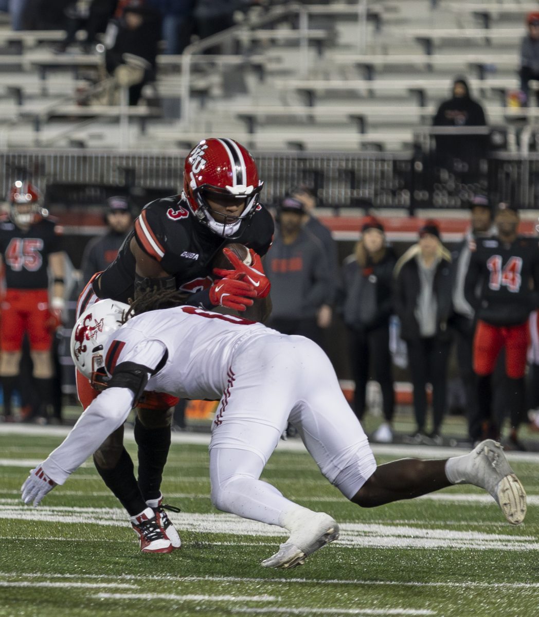 Western Kentucky running back Elijah Young (3) is tackled during a run by Jacksonville State safety Fred Perry (6) during WKU’s game against Jacksonville State in L.T. Smith Stadium in on Saturday Nov. 30, 2024. WKU won 19-17.