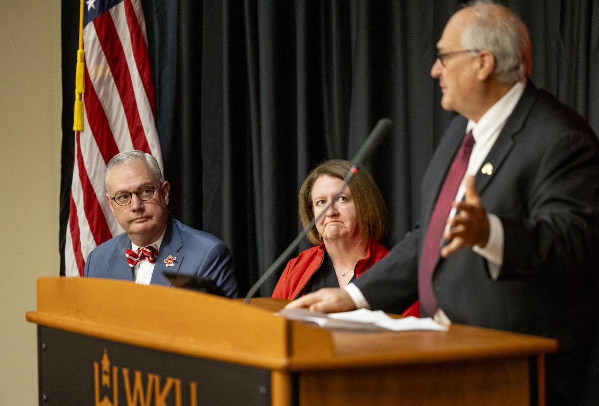 President Tim Caboni and Corinne Murphy listen to State Representative James Tipton speak at the 2024 Kentucky Teacher Hall of Fame induction ceremony on Friday, Nov. 22, 2024. 