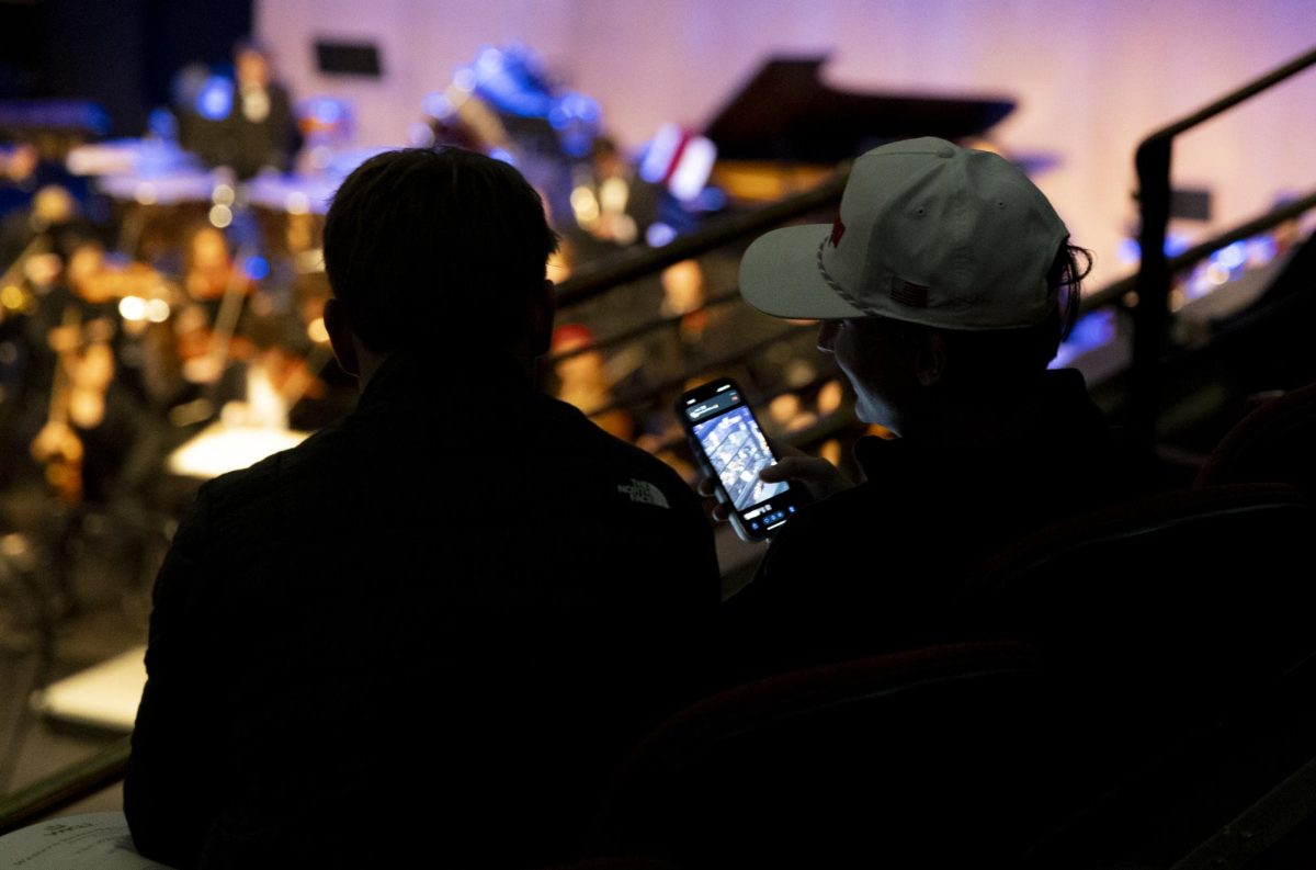 Audience members watch the WKU Symphonic Band during the Holidays On The Hill concert in Van Meter Hall on Friday, Nov. 22, 2024.