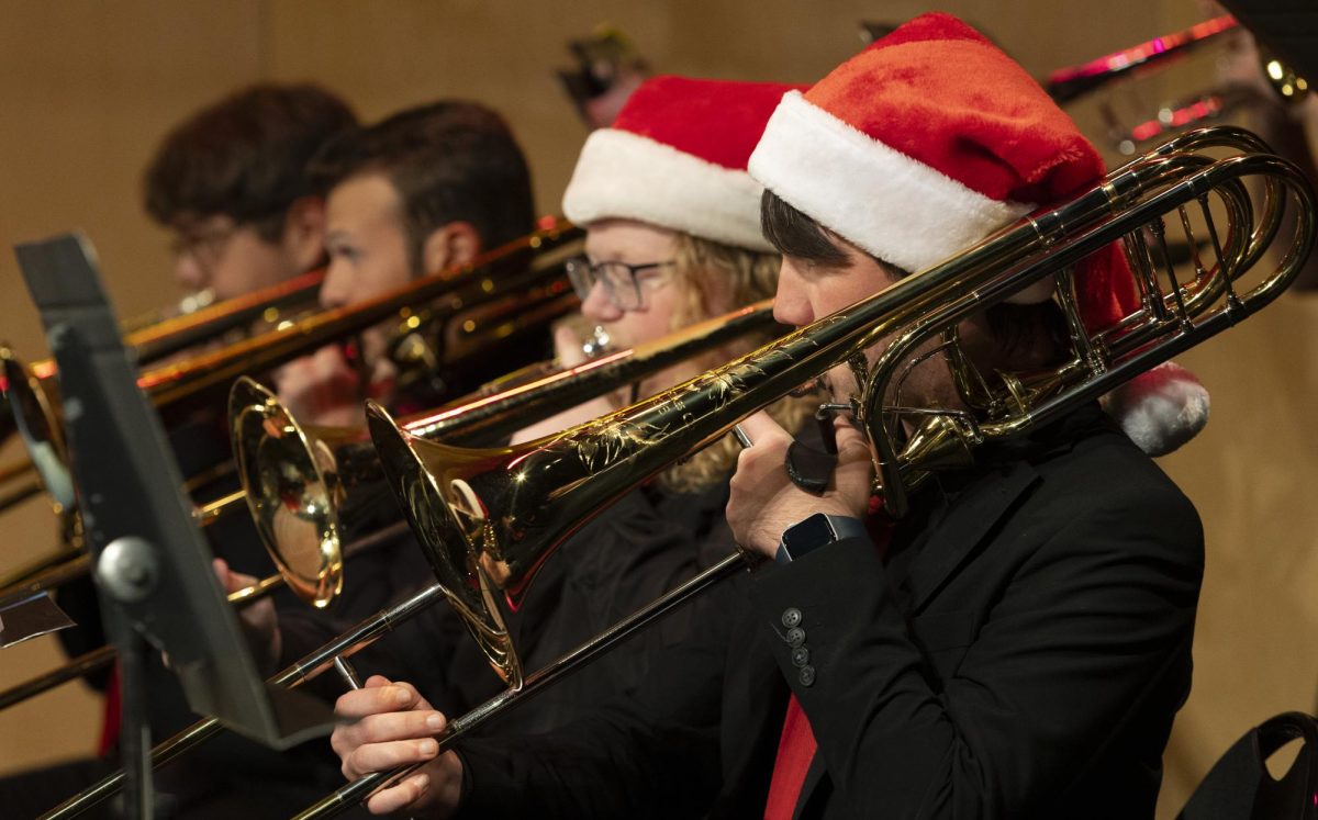 The WKU Jazz Band’s trombone section performs during the Holidays On The Hill concert  in Van Meter Hall on Friday, Nov. 22, 2024.