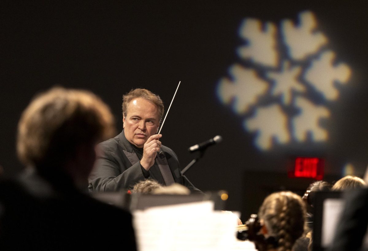 Dr. Brian St. John conducts the WKU Symphonic Band during the Holidays On The Hill concert  in Van Meter Hall on Friday, Nov. 22, 2024.