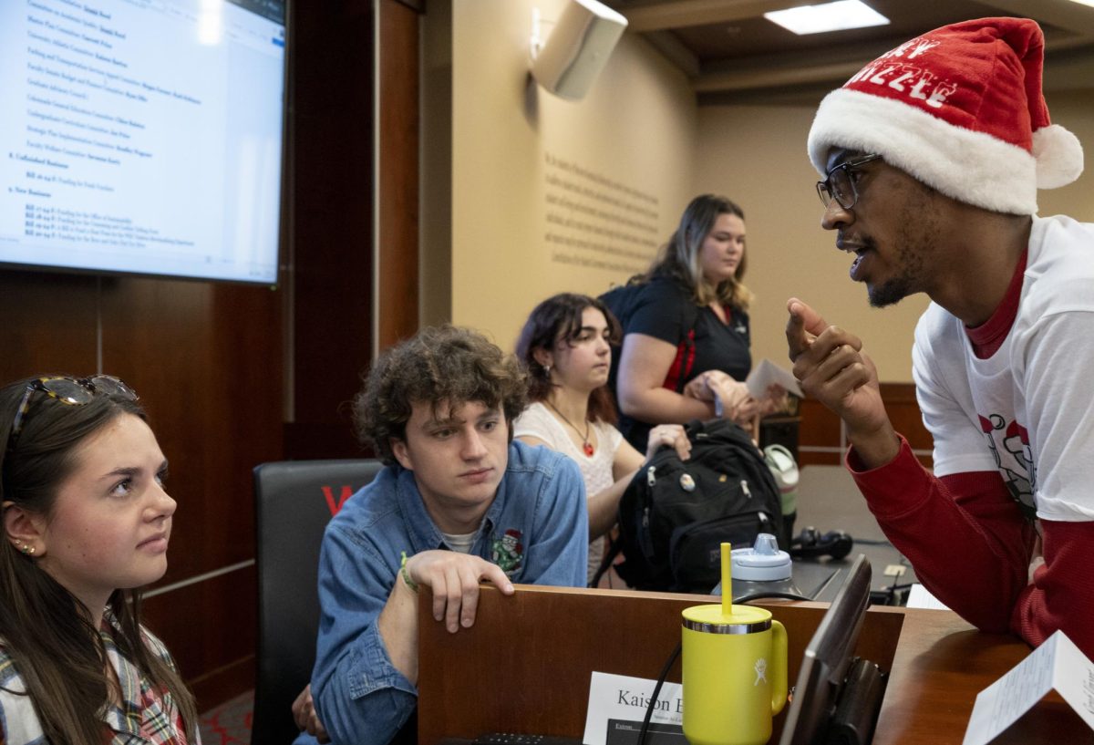 Student Body Vice President Donte Reed speaks with Speaker of the Senate Sarah Vincent before their weekly meeting on Tuesday, Nov. 19, 2024.