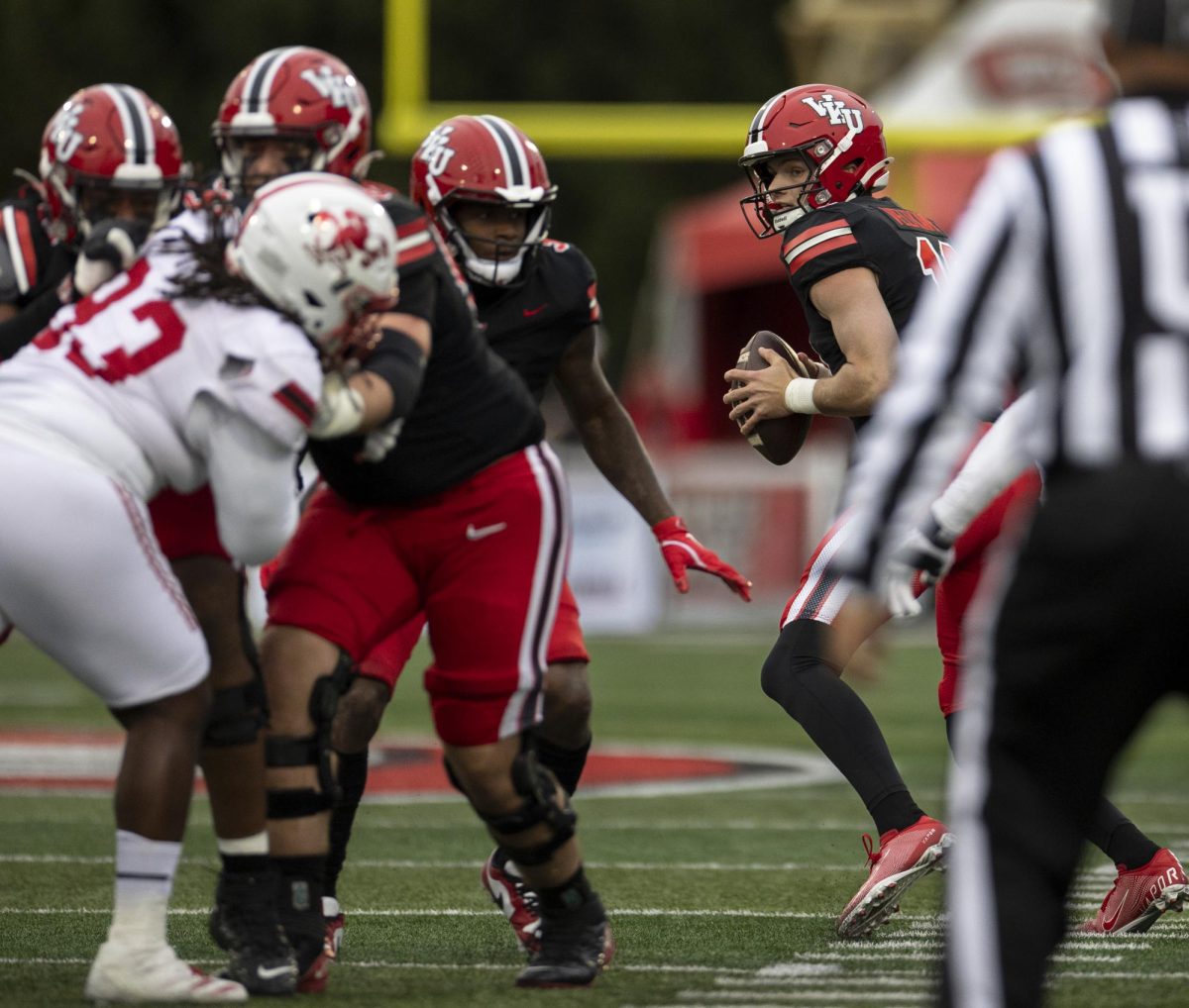 Western Kentucky quarterback Caden Veltkamp (10) looks for an opportunity during WKU’s game against Jacksonville State in L.T. Smith Stadium in on Saturday Nov. 30, 2024. WKU won 19-17.