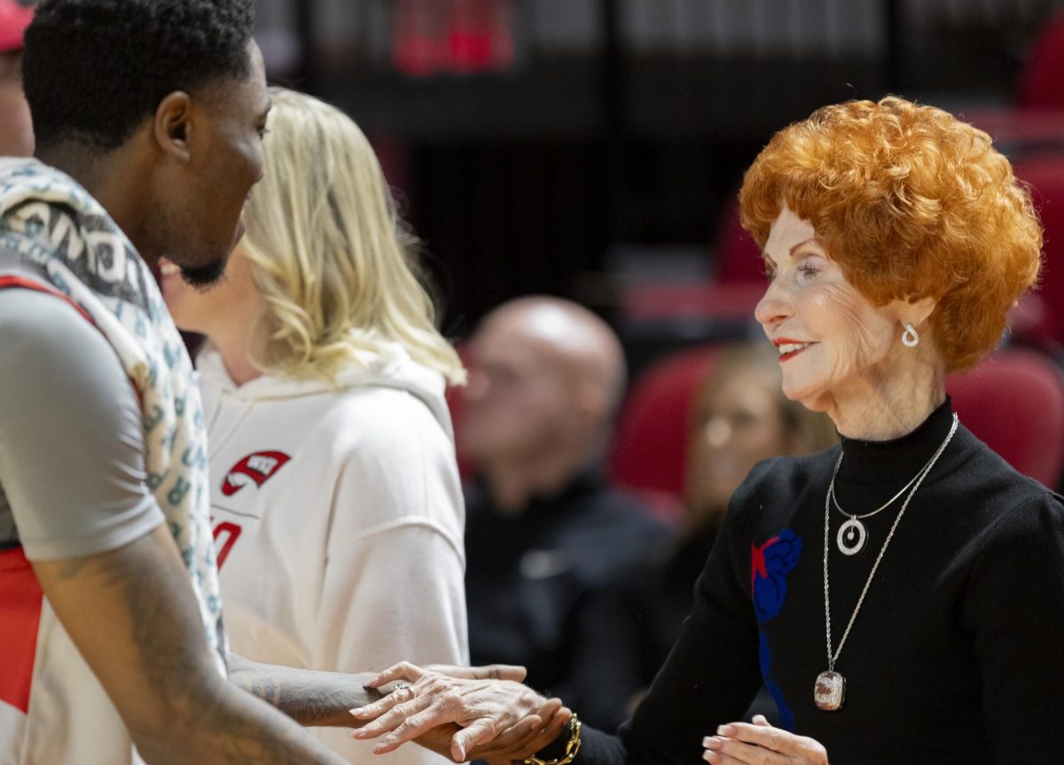 Dixie Mahurin (right) shakes Guard Don McHenry’s hand after the Hilltoppers win against Jackson State University at E.A. Diddle Arena on Nov. 20, 2024. The Hilltoppers won 79-62.