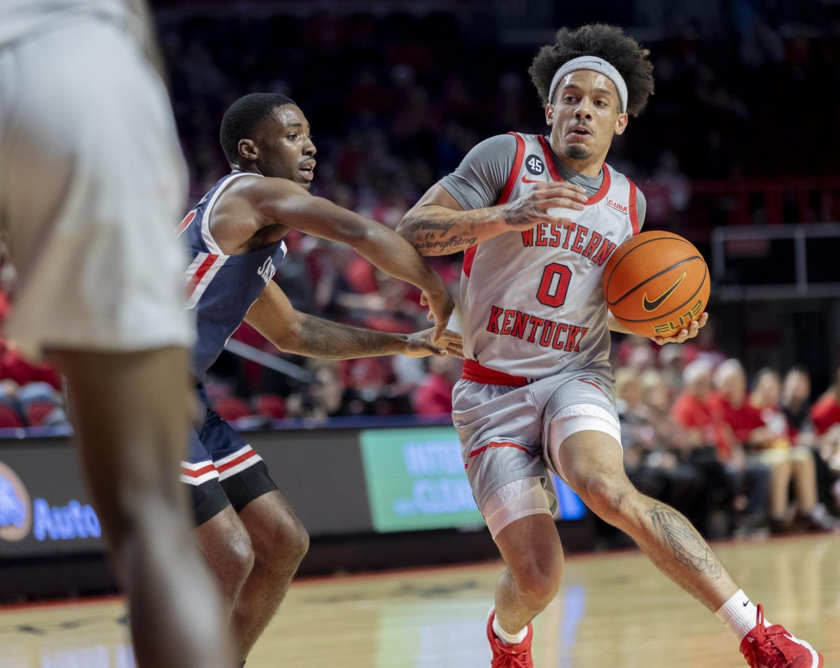 Guard Braxton Bayless (0) fights to keep possession of the ball during the match against Jackson State University on Nov. 20, 2024. The Hilltoppers won 79-62.