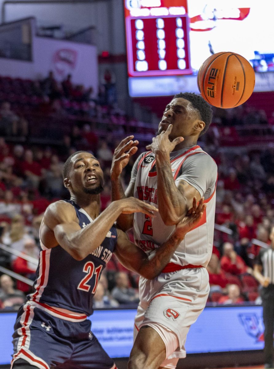 Guard Don McHenry (2) loses possession of the ball due to Guard Marcus Watson Junior (21) during the match against Jackson State University at E.A. Diddle Arena on Nov. 20, 2024. The Hilltoppers won 79-62.