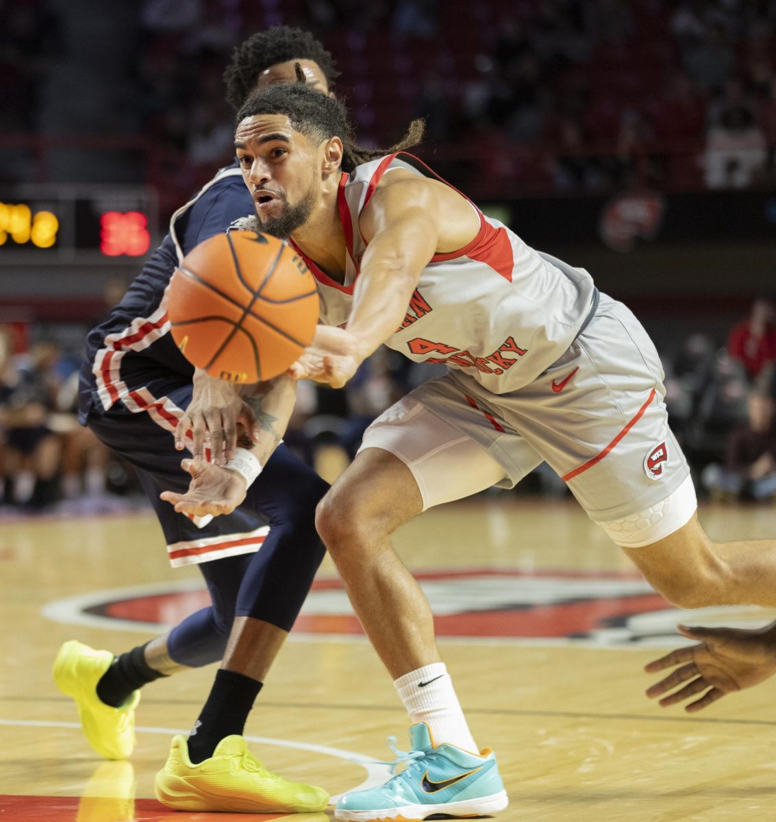 Guard Khristian Lander (4) passes the ball during the match against Jackson State University at E.A. Diddle Arena on Nov. 20, 2024. The Hilltoppers won 79-62.