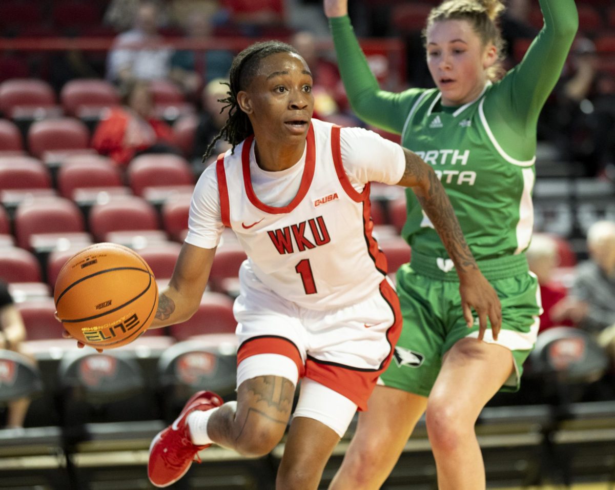 Western guard Destiny Salary (1) drives the ball up the court through the Fighting Hawks defense during WKU’s match against North Dakota on Sunday, Nov. 24, 2024 at E.A. Diddle Arena. Destiny contributed 11 points to WKU’s 74-69 win.