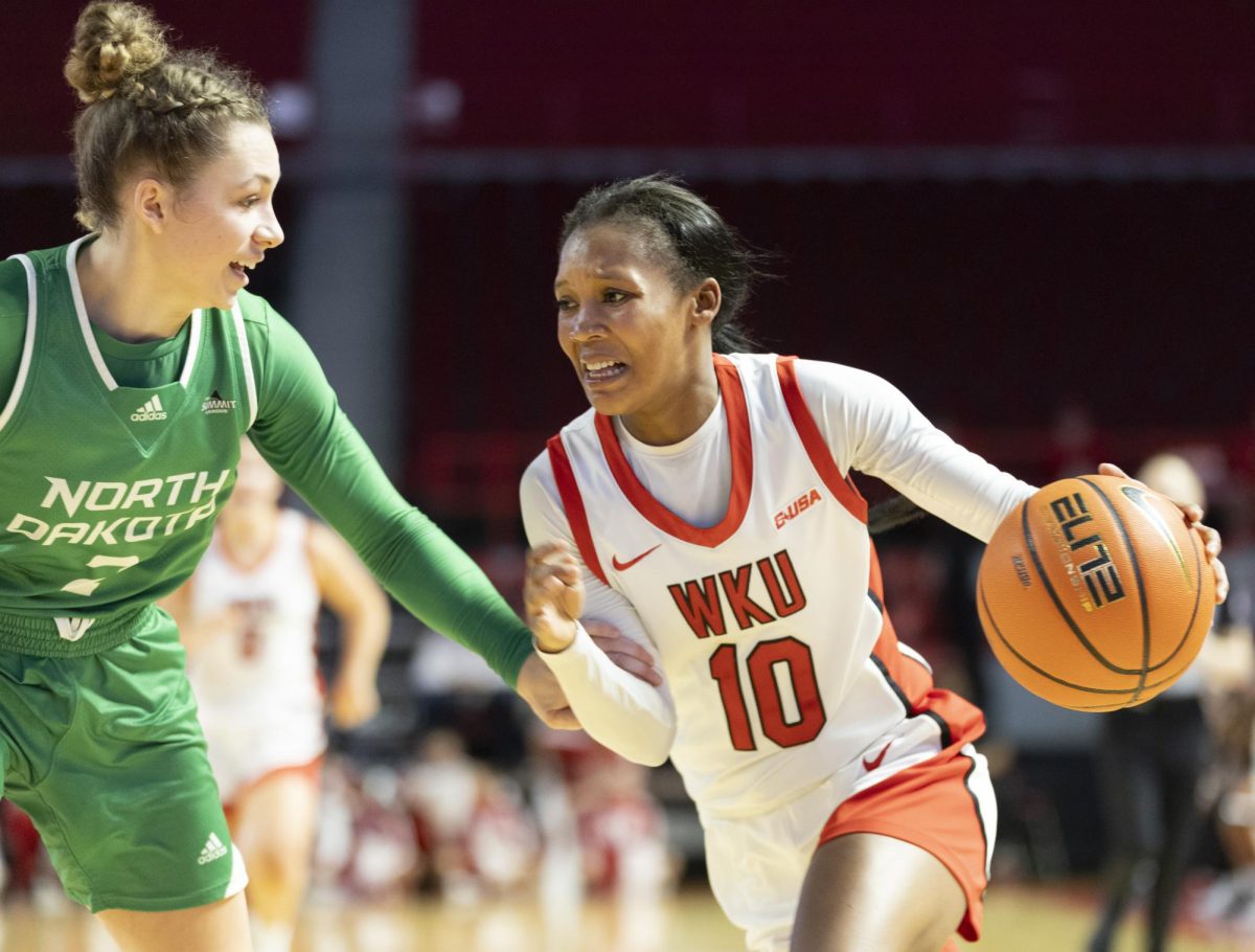 Western guard Acacia Hayes (10) drives the ball to the basket during WKU’s match against North Dakota on Sunday, Nov. 24, 2024 at E.A. Diddle Arena. Acacia was the highest scorer of the game, at 21 points. 