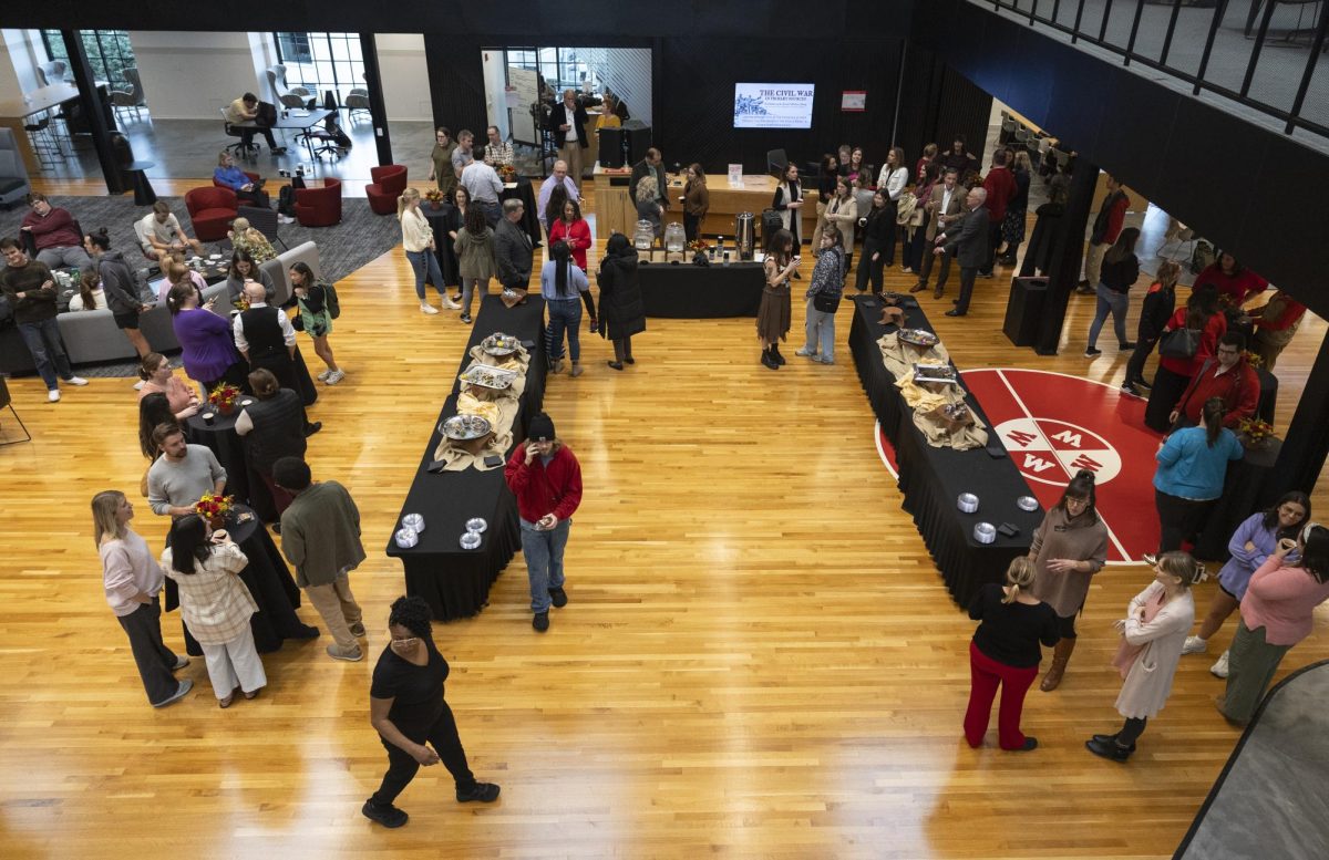 Attendees mingle at the Hilltopper Family Fall Gathering hosted by President Timothy C. Caboni in the Commons on Tuesday, Nov. 19, 2024. 